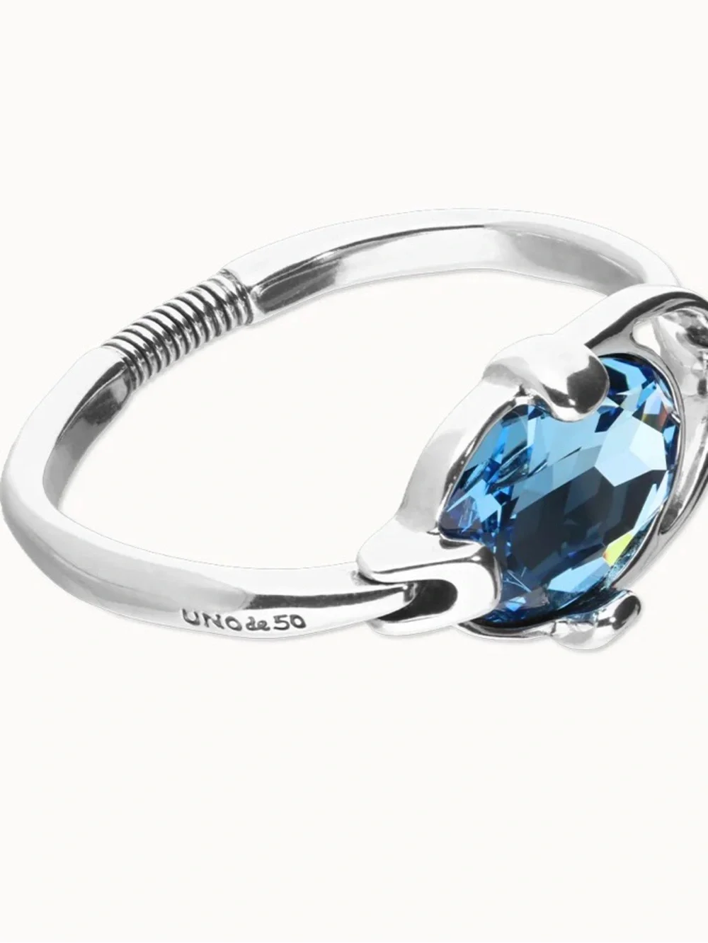 Uno de 50 bangle bracelet with faceted blue crystal